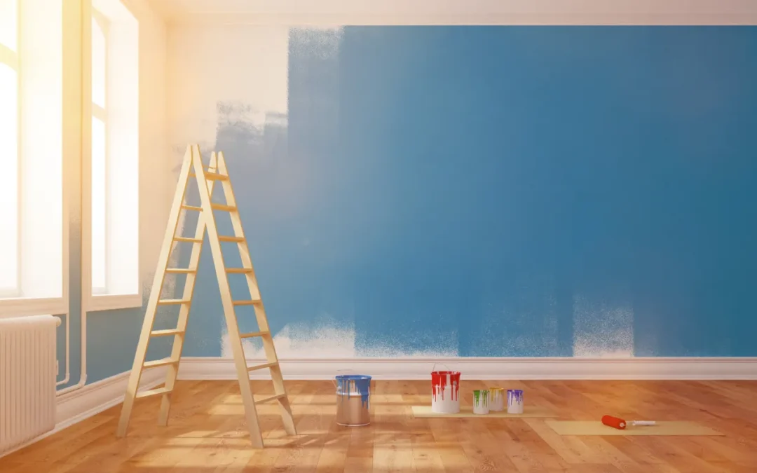 An indoor room being painted blue illustrating the blog post's purpose of explaining What is the Best Time of Year to Paint Interiors for the Longest-Lasting Results?