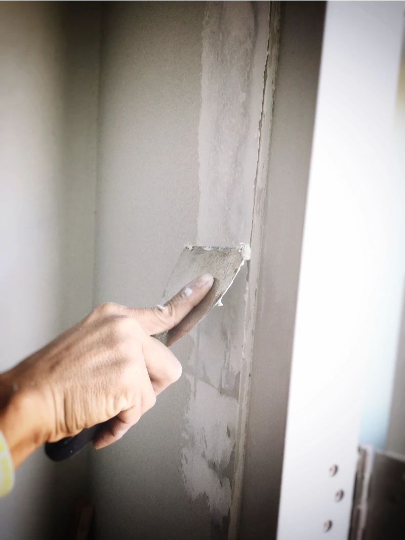 plaster repair on a wall in home